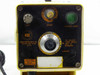 Liquid Metronics dosing pump front control panel detail showing 5-amp fuse, speed knob, green stroke light, stroke adjustment knob, and wiring label