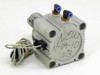 SMC CDQ2KB80-UIA980 pneumatic cylinder – side view showing aluminum body with handwritten label and push-in elbow fittings on top