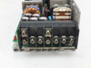 ELCO K150A-12 terminal block close-up showing screw-terminal output connections and adjacent toroid inductors