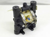 Wilden 00-5411-16 double diaphragm pump front-right view showing blue pilot valve spool in center air section and top discharge port caps