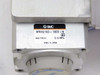 SMC MRHQ16D-180S-N label closeup showing model number, EW marking, max pressure 0.6 MPa, and Made in Japan; engraved number 22696 visible on housing