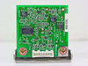 Okano Works PSG-18 PCB rear view — green circuit board with IC components including ADB62BAR, M78L05ACM, 74HC4066AF; serial number label visible on right edge