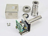 Okano Works PSG-18 Vacuum Pressure Sensor fully disassembled — stainless body, PCB, housing cover, threaded collar, and mounting screws laid out on white background