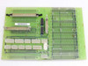Netstal THE 110.240.9413 system board — reverse side alternate angle showing flat cable connectors, DIP IC chip, DB-style connector, and power connector bank