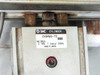 SMC CXSM20-75 XU pneumatic cylinder label showing max pressure 0.7 MPa / 100 PSI