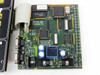 Netstal CAN 110.240.9335 Komplett interface PCB close-up showing main ICs, DB9 connectors, Toshiba and Sanvik chips, and ribbon cable connector