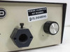 Hybond FOS 101 close-up of front panel fiber optic port and rotary brightness control knob with calibration sticker