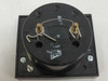 Omega 7035-J-500 panel meter — rear view showing two gold terminal posts, plus polarity marking, and 110Ω Peak label on movement