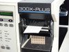 Brady BradyPrinter THT 300X-Plus top-open print mechanism view with label stock loaded and exiting output slot
