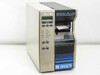 Brady BradyPrinter THT 300X-Plus thermal transfer label printer – front left three-quarter view showing control panel and print output