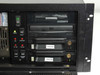 DiviCom NMS-RM-NM drive bay detail showing 3.5 inch floppy drive, CD-ROM drive, and two labeled THESYS01 and THESYS00 hard drive trays