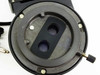 Wild 327616 illuminator — bottom view of ring mount showing two circular optical lenses in black carrier plate, adjustment knob, and mounting screws