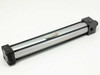 Norgren pneumatic cylinder – opposite side view showing label on barrel and rod end fitting