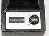Bausch & Lomb 31-35-28 front panel close-up — rotary control knob with Off, 1, 2, 3 positions and Bausch & Lomb logo badge