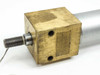 Close-up of front brass end cap and threaded shaft showing end cap face with two port holes and machined shaft detail