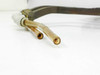 Close-up of the two open 0.5-inch copper port tube ends with brazed fitting junction, showing interior bore and oxidation on tube surfaces