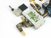 Numatics L23BA452B valve assembly — angled top view showing solenoid coil, tubing connections, and numbered brass fittings