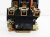 Square D 8536 SF01 motor starter — side view of lower contact assembly showing X2 marking, copper lugs, and mounting foot