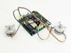 ADIC 17-1076-01 system board with two P5N-U03S-148 stepping motors connected via multi-color wire harnesses — top angled view