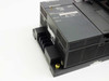 Side and bottom view of Mitsubishi A1SJHCPU CPU base unit showing DIN rail mounting slot and ventilation fins