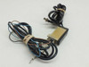 Omron E3X-A11 sensor amplifier and fiber head shown with coiled cable leads from opposite angle