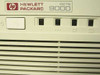 HP 9000 827S front panel close-up showing power button, drive indicators, and Hewlett Packard 9000 logo