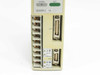 Mitsubishi MR-J10A — lower front connector area showing 8-position screw terminal block, CN1 and CN2 D-sub connectors, and Japanese caution/danger labels