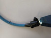 Close-up of fiber optic light guide blue vinyl trunk showing tear and crack in the outer shrouding near the blue aluminum splitter block input connector