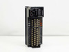 Mitsubishi AX41C MELSEC PLC I/O Module – front panel view showing station number dial, RUN/ERR indicators, and terminal block connections