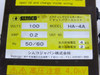 Simco HA-4A rating label close-up — Simco logo, model HA-4A, 100V, 0.2A, 50/60Hz, 4KV output, 2mA short-circuit current, Simco Japan markings