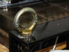 Close-up of steel lifting eye bolt on transformer frame showing heavy-duty cast construction
