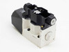 Tokimec 02-123806 D7-24 hydraulic solenoid valve — rear-left three-quarter view showing aluminum manifold base and solenoid assembly