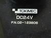 Tokimec DC24V label close-up showing brand name, voltage rating DC24V, and part number P.N. 02-123806