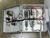 Interior of Process Technology control enclosure showing contactors, terminal blocks, relay wiring, and solid-state relay