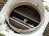 Interior view of UV lamp aperture on UE041-401-05C housing showing lamp tube and reflector assembly inside cylindrical opening