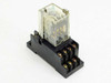 Omron MY4N-D2 relay on socket base — three-quarter rear view showing internal coil and contact assembly through clear housing