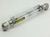 King Instrument 7511315B03 acrylic rotameter front view showing clear tube, float, scale, and stainless 90° elbow fittings with warning label