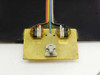 AMG Test Engineering 500 ResBox – close-up of head test fixture board showing two trimmer potentiometers, ribbon cable connections, and spring-loaded head clamp fixture