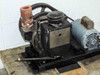 Welch Duo-Seal vacuum pump body close-up showing nameplate, red inlet fitting, and oil chamber top with cap