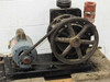 Welch Duo-Seal vacuum pump — rear-left view showing flywheel, drive belt, and motor on steel base frame