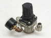 SMC AR30-N03-Z pneumatic regulator rear-left view showing gauge, body, and brass elbow fitting