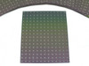 Single Nanosolar NanoCell CIGS cell laid flat showing full 165x135mm active surface with MWT star pattern and iridescent green-to-purple gradient