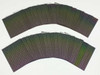 Fan-spread view of multiple Nanosolar NanoCell CIGS solar cells showing iridescent active surface and flexible nature of the aluminum substrate