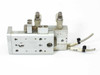 SMC MXS6-20 – bottom-angle view showing port face, adjustable end-stop hardware, and dual sensor cables