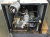 Matsui MCM-151 internal view showing motor, Speck Pumpen pump assembly, brass manifold block, solenoid valves, copper and pneumatic tubing, and wiring — rust and corrosion visible on enclosure floor and components