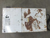 Matsui MCM-151 top/side panel view showing extensive rust, peeling paint, caution warning labels, and HOT surface warning sticker