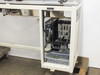 Controller enclosure interior — Yamaha DRC-2 controller unit and Sharp JW PLC rack with multiple modules