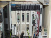 Sharp JW PLC rack close-up — modules JW-1PU, JW-70CUN, JW-20CM, JW-10SU, JW-64NC, JW-325 installed