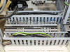 Terminal block wiring panel — multiple labeled terminal strips with green/yellow ground wiring