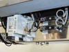 Lower enclosure interior — DIN rail mounted components, contactors labeled SV121/SV122, Idec PX050/PX047 devices